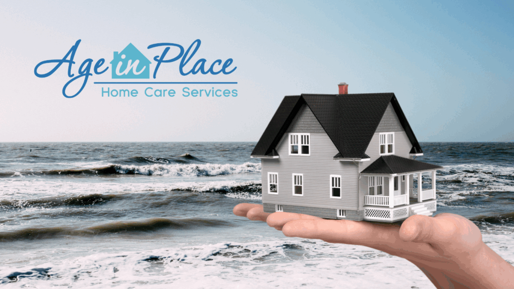 Picture of a hand holding a home with the beach in the background