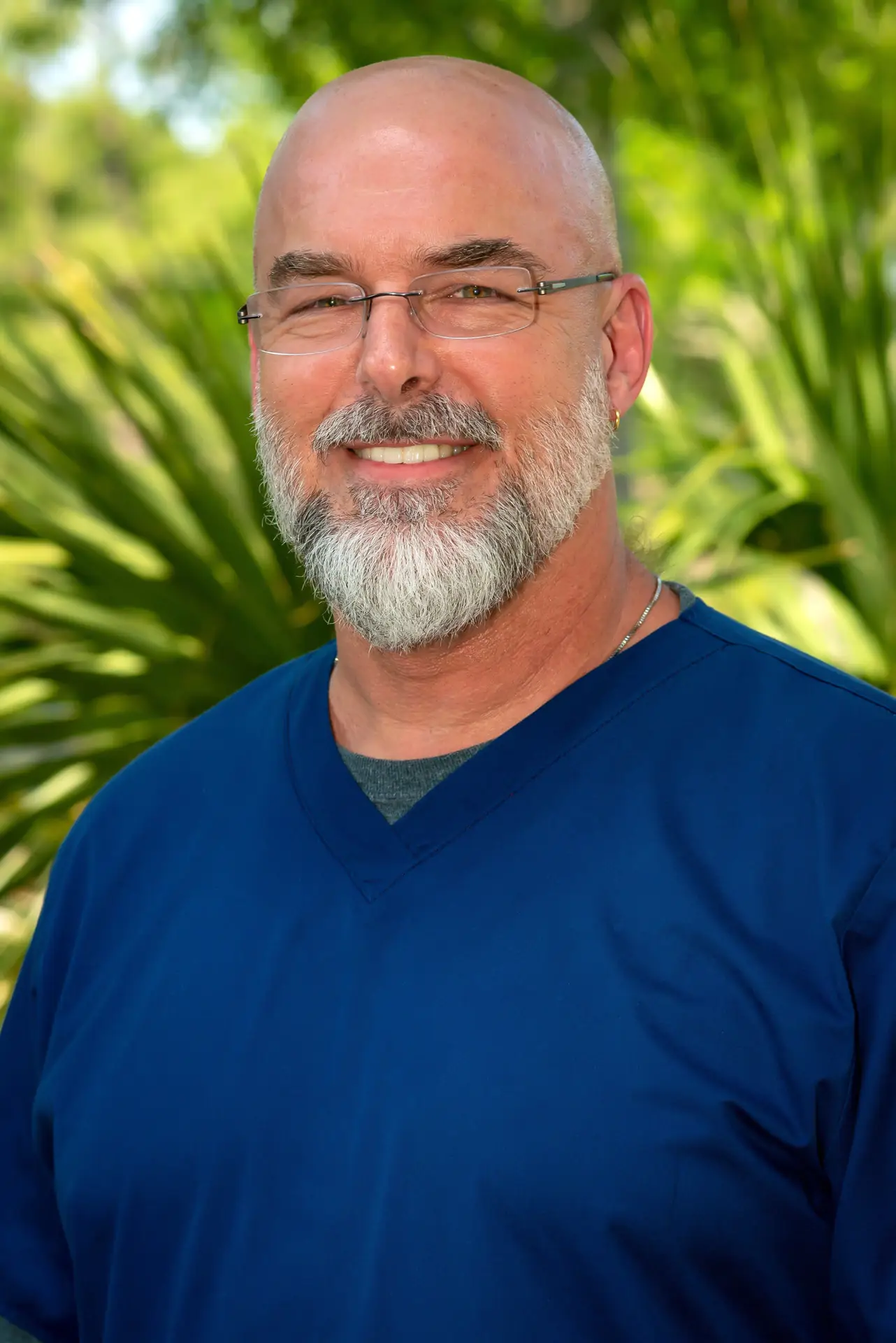 Michael Walton-Jones, Age in Place RN, smiling outdoors.