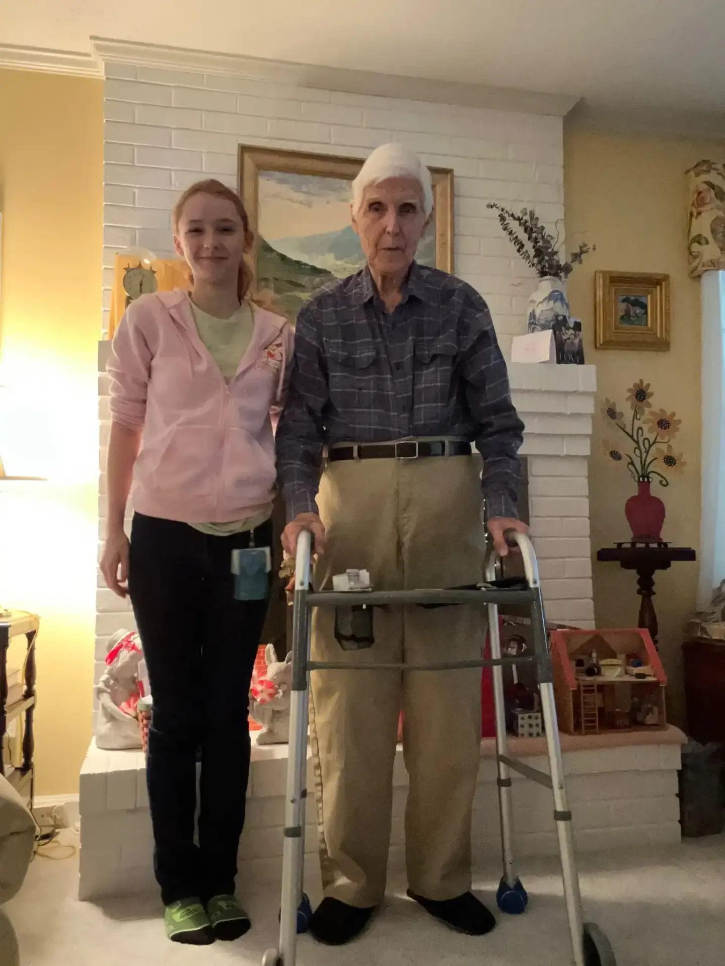 Caregiver and senior with walker promoting fall prevention in Wilmington home.